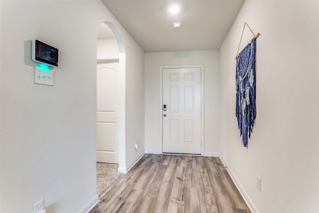 hall with light wood-type flooring