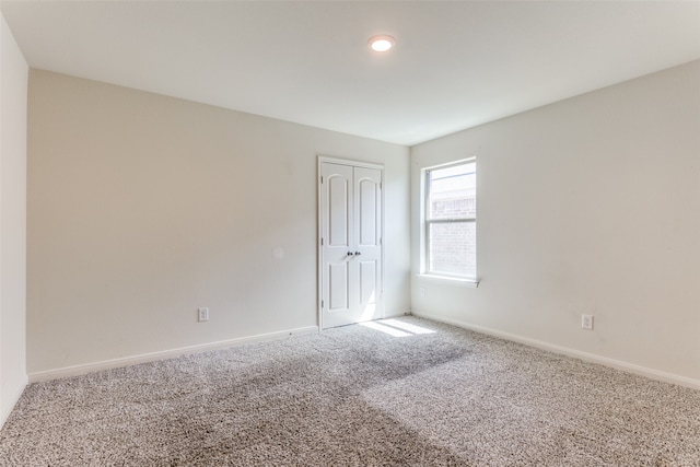 unfurnished room featuring carpet floors