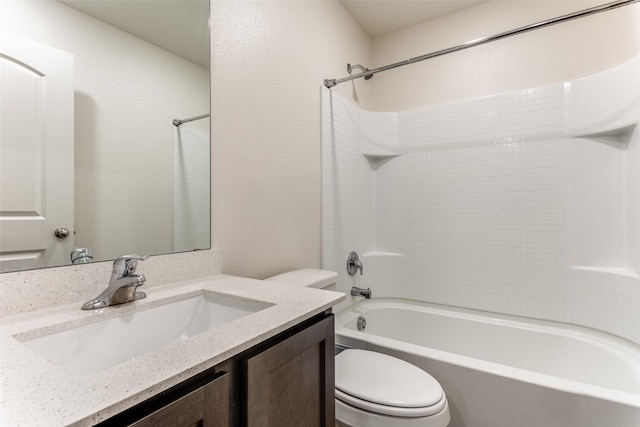 full bathroom featuring vanity, washtub / shower combination, and toilet