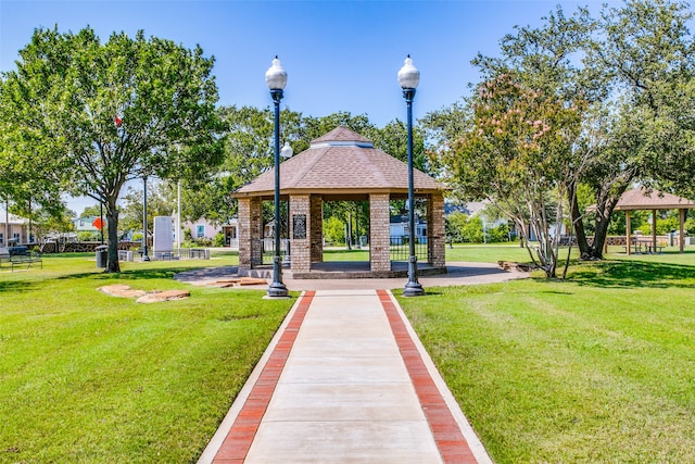 view of community featuring a gazebo and a yard