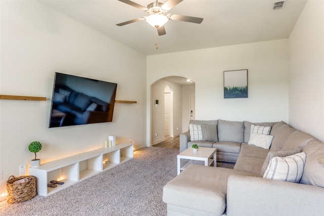 living room with carpet floors and ceiling fan