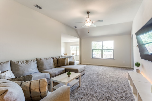 living room featuring carpet and ceiling fan