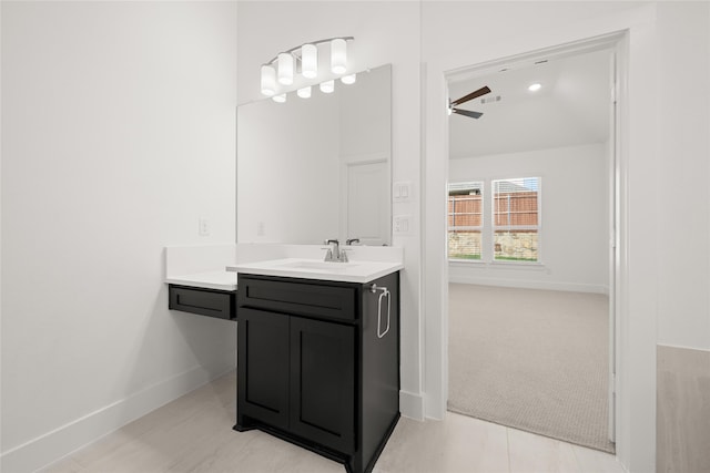 bathroom with ceiling fan, tile patterned flooring, and vanity