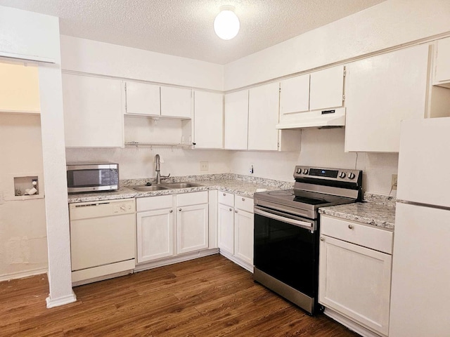 kitchen featuring stainless steel appliances, white cabinetry, and sink