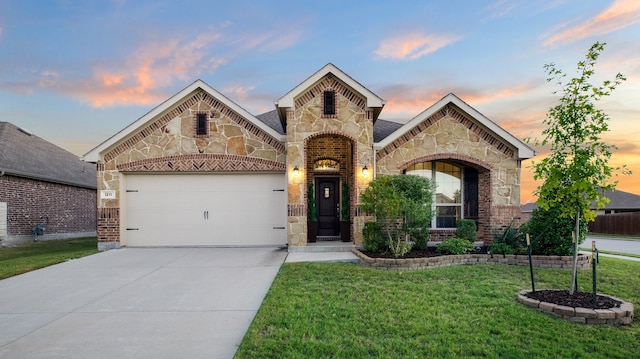 view of front facade featuring a lawn and a garage