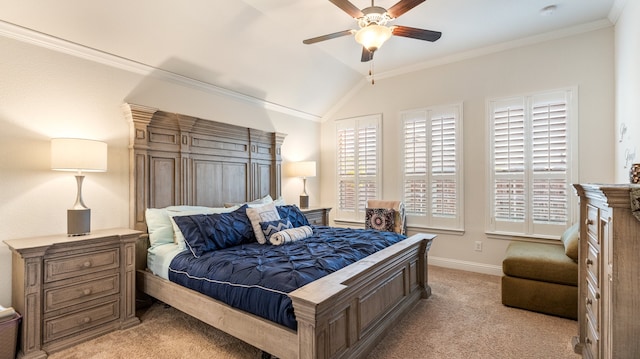 carpeted bedroom with ornamental molding, vaulted ceiling, and ceiling fan