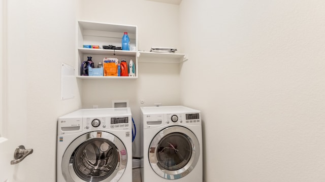 washroom with washer and clothes dryer