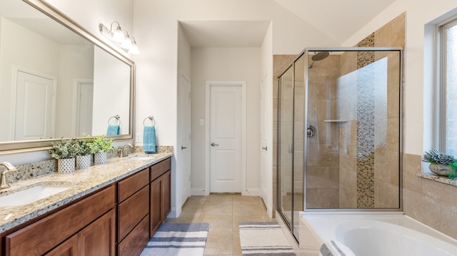 bathroom featuring vanity, shower with separate bathtub, and tile patterned floors