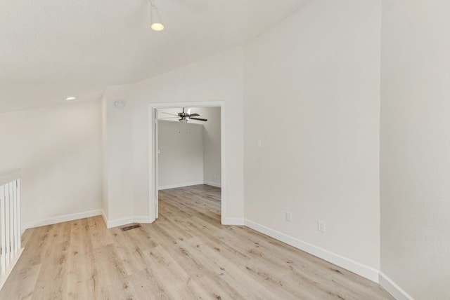 bonus room with light hardwood / wood-style flooring, lofted ceiling, and ceiling fan