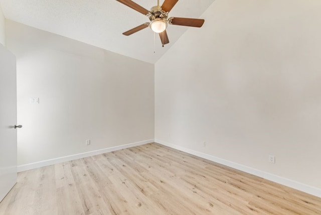 unfurnished room featuring light wood-type flooring, a textured ceiling, lofted ceiling, and ceiling fan