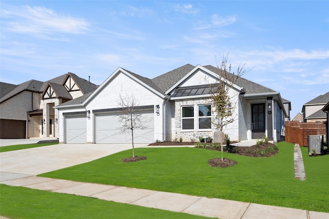 view of front of house featuring a front lawn and a garage