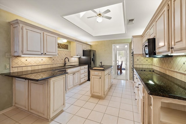 kitchen with ceiling fan, light tile patterned floors, sink, and decorative backsplash