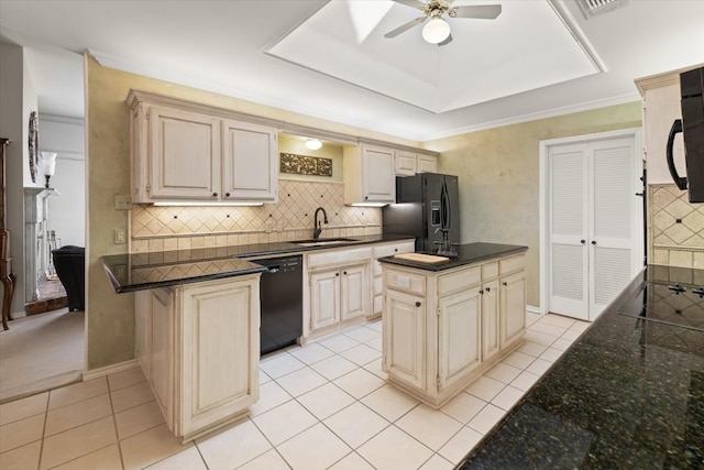 kitchen featuring ceiling fan, sink, decorative backsplash, and black appliances