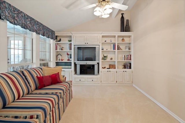 carpeted living room featuring ceiling fan and lofted ceiling