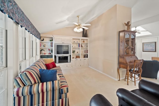 carpeted living room featuring vaulted ceiling and ceiling fan