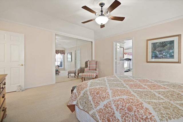 bedroom with light carpet, a closet, ceiling fan, and crown molding