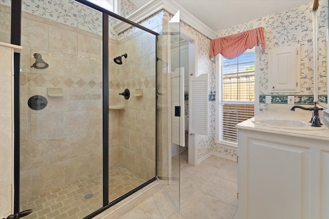 bathroom with tile patterned floors, an enclosed shower, and vanity