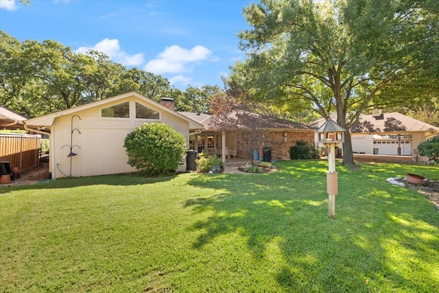 view of front of home with a garage and a front yard