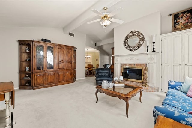 living room featuring lofted ceiling with beams, light carpet, ceiling fan, and a fireplace