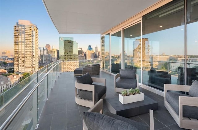 3130 N Harwood St Unit 1506, Dallas, TX 75201 - balcony with an outdoor hangout area and a city view