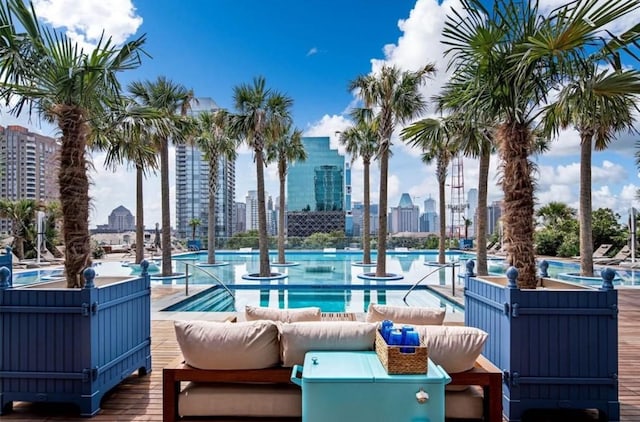 3130 N Harwood St Unit 1506, Dallas, TX 75201 - view of patio with an outdoor living space, a city view, and a community pool