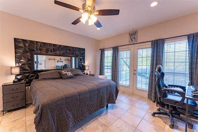 tiled bedroom featuring ceiling fan and access to outside