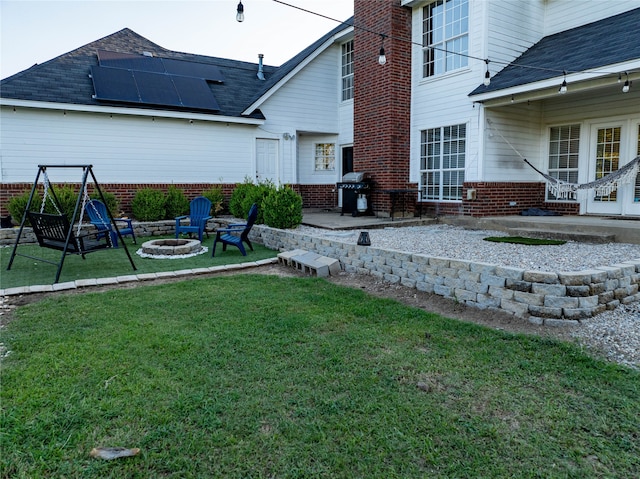 view of yard with a patio and a fire pit