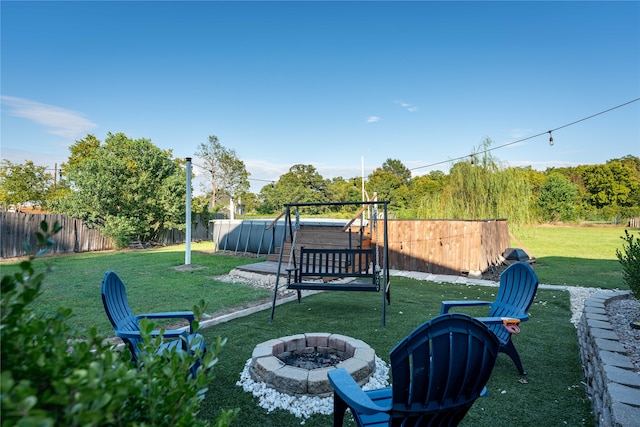 view of yard with an outdoor fire pit