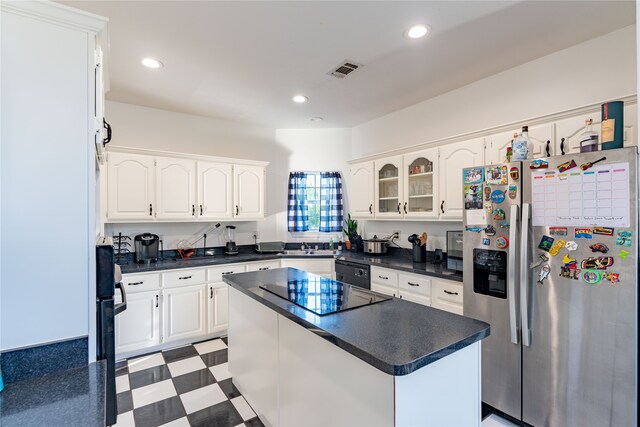 kitchen featuring sink, a center island, white cabinetry, and black appliances