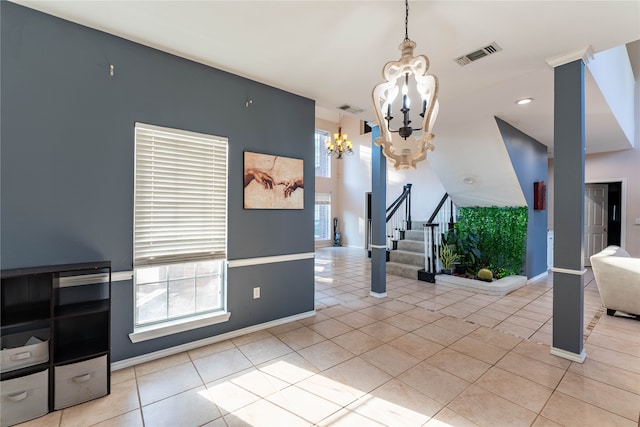 dining area featuring a notable chandelier and light tile patterned floors