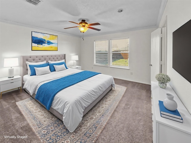 carpeted bedroom with a textured ceiling, ceiling fan, and crown molding