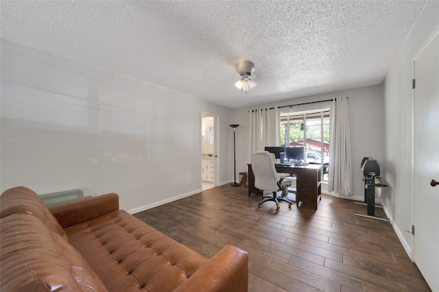 office area with a textured ceiling and ceiling fan