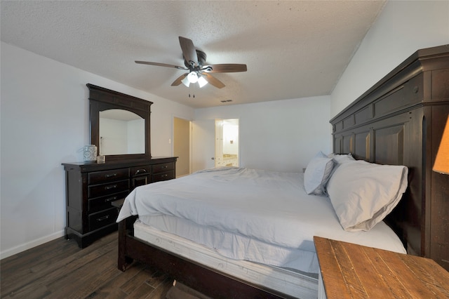 bedroom with dark hardwood / wood-style floors, a textured ceiling, and ceiling fan