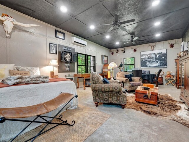 interior space featuring an AC wall unit, multiple windows, and unfinished concrete flooring