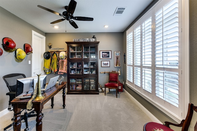 office featuring ceiling fan and light colored carpet