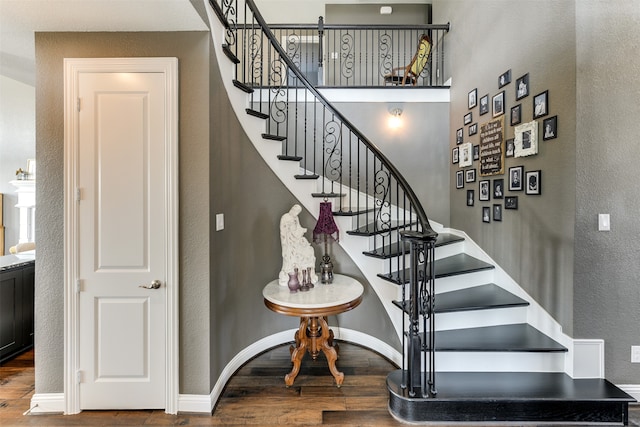 stairs featuring wood-type flooring