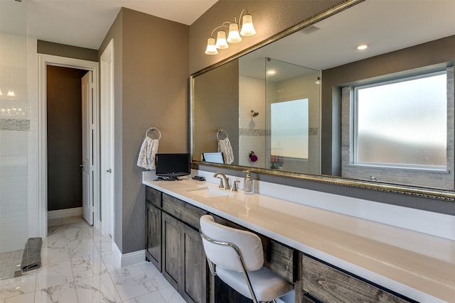 bathroom featuring vanity and tiled shower