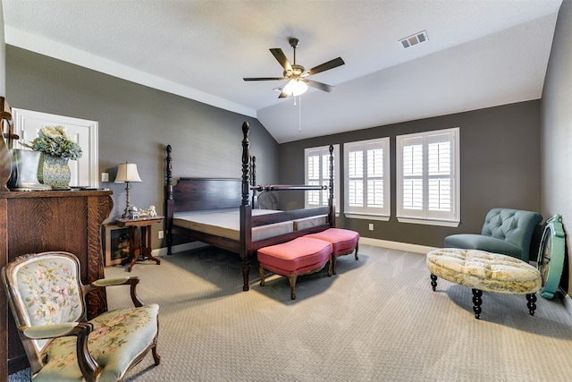 bedroom with lofted ceiling, ceiling fan, and light colored carpet