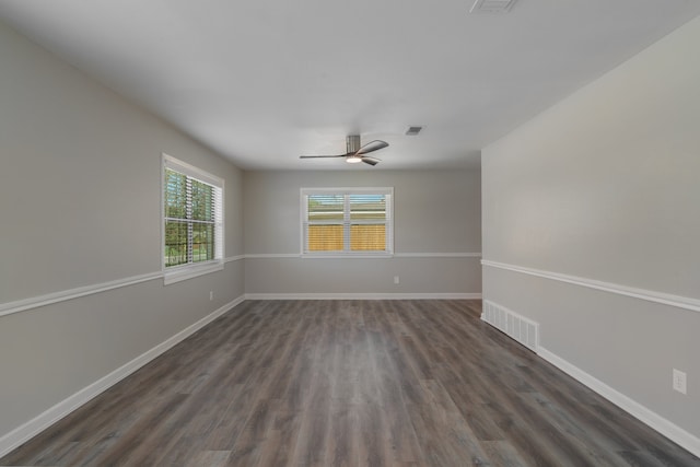 spare room featuring ceiling fan and dark hardwood / wood-style flooring