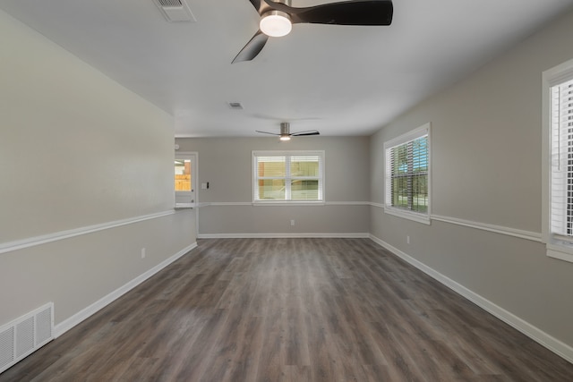 unfurnished room featuring ceiling fan and dark hardwood / wood-style floors