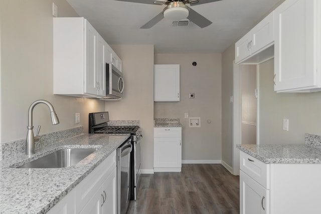 kitchen featuring stainless steel appliances, white cabinets, ceiling fan, and dark hardwood / wood-style floors