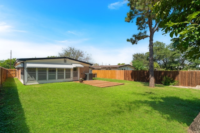 view of yard featuring central AC