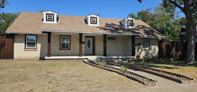 view of front of house featuring a front yard and a porch