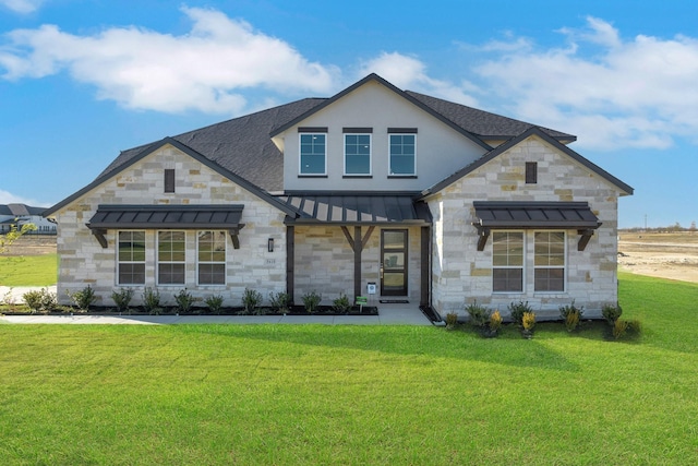 5610 Gaelic Dr, Celina, TX 75009 - view of front of house with a standing seam roof, stone siding, a shingled roof, a front yard, and metal roof
