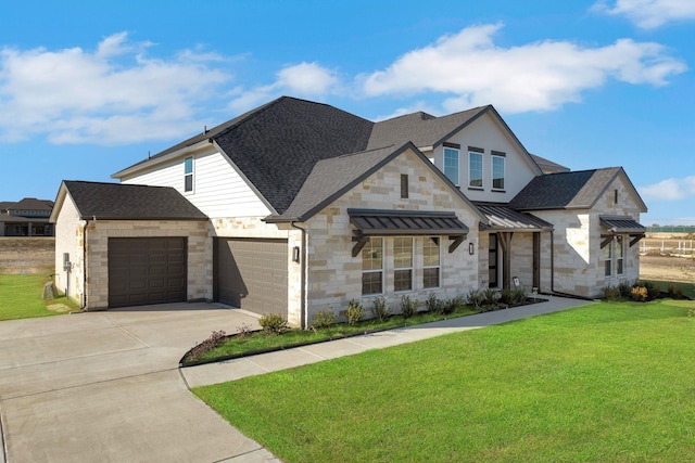 5610 Gaelic Dr, Celina, TX 75009 - view of front facade featuring stone siding, a front yard, an attached garage, and driveway