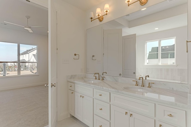 bathroom featuring vanity and ceiling fan