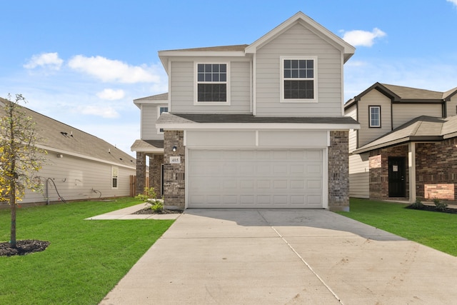 front facade with a yard and a garage