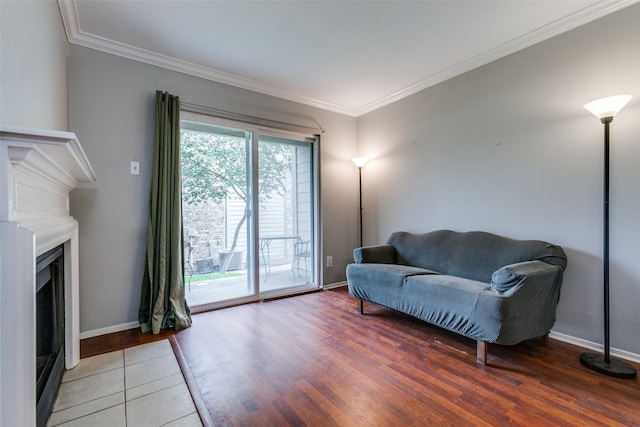 living area featuring ornamental molding and hardwood / wood-style floors