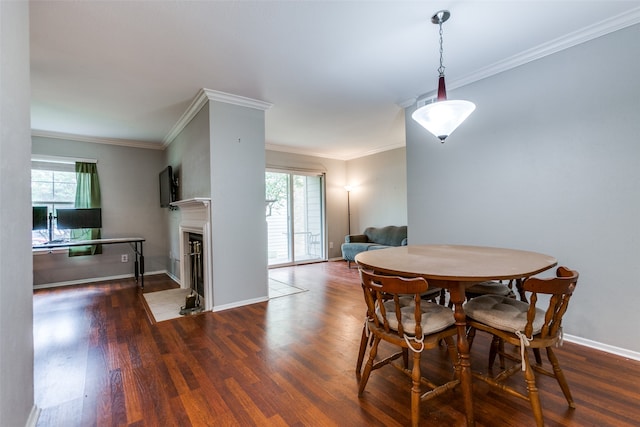 dining space featuring crown molding and dark wood-type flooring