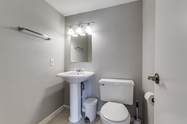 bathroom featuring tile patterned flooring and toilet